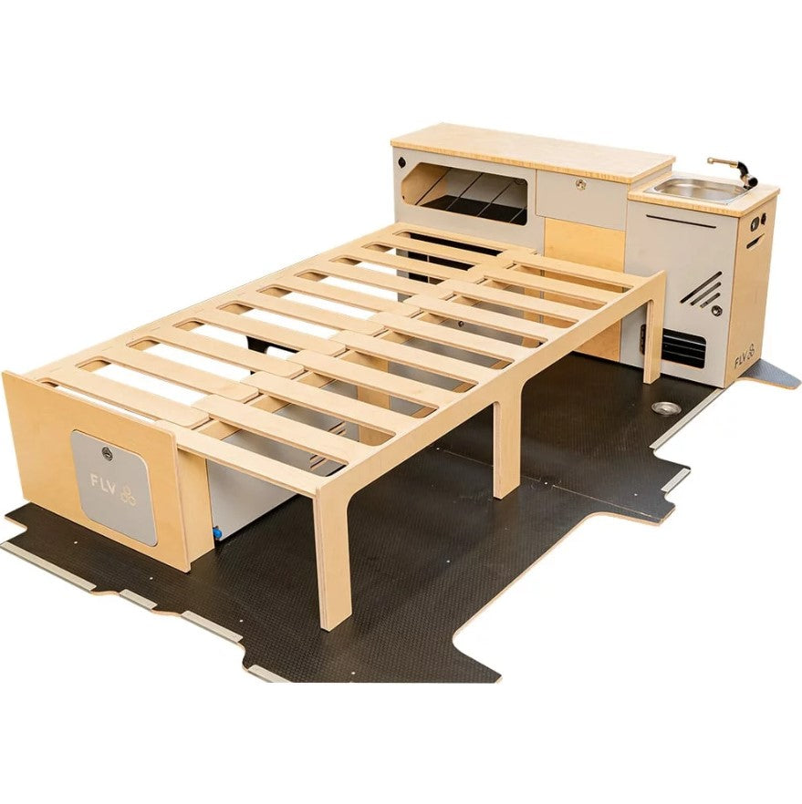 Módulo de mobiliario para VAN con un módulo de almacenamiento de cocina y una cama